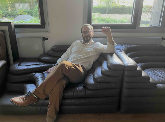 Martin Schwartz on Fassbinder's own couch from his Munich apartment, as seen in Deutschland im Herbst! (Photo credit Isabelle Bastian) 