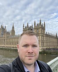 Standing before the British Parliament building.