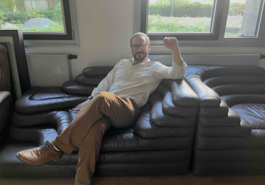 Martin Schwartz on Fassbinder's own couch from his Munich apartment, as seen in Deutschland im Herbst! (Photo credit Isabelle Bastian) 